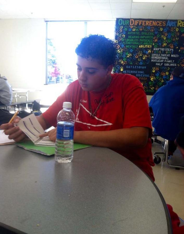 Freshman, Isaiah Westbrooks wastes no time afer school to begin his studies before football practice. The A.C.E. program is helping young students athletes balance their time freshman. Photo courtesy of Chris White