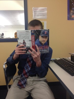 An SHS student reads "Francona" to combat his Winter baseball withdrawls. 