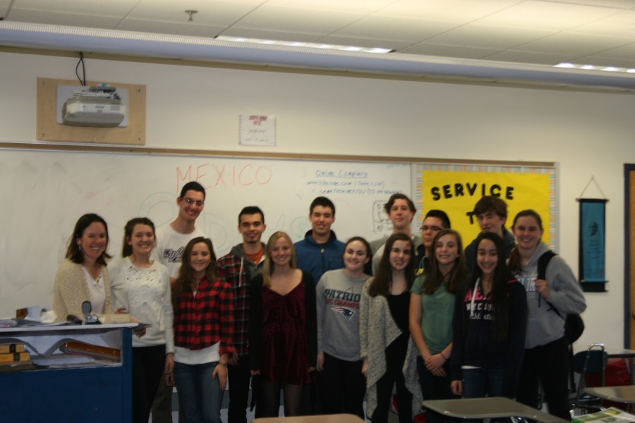 Students in the Mexico Service smile for the camera at one of their meetings held every Wednesday in Ms. Hallihan’s classroom. They embark on their journey to Mexico on April 17. Photo courtesy of Maeve Dunn.