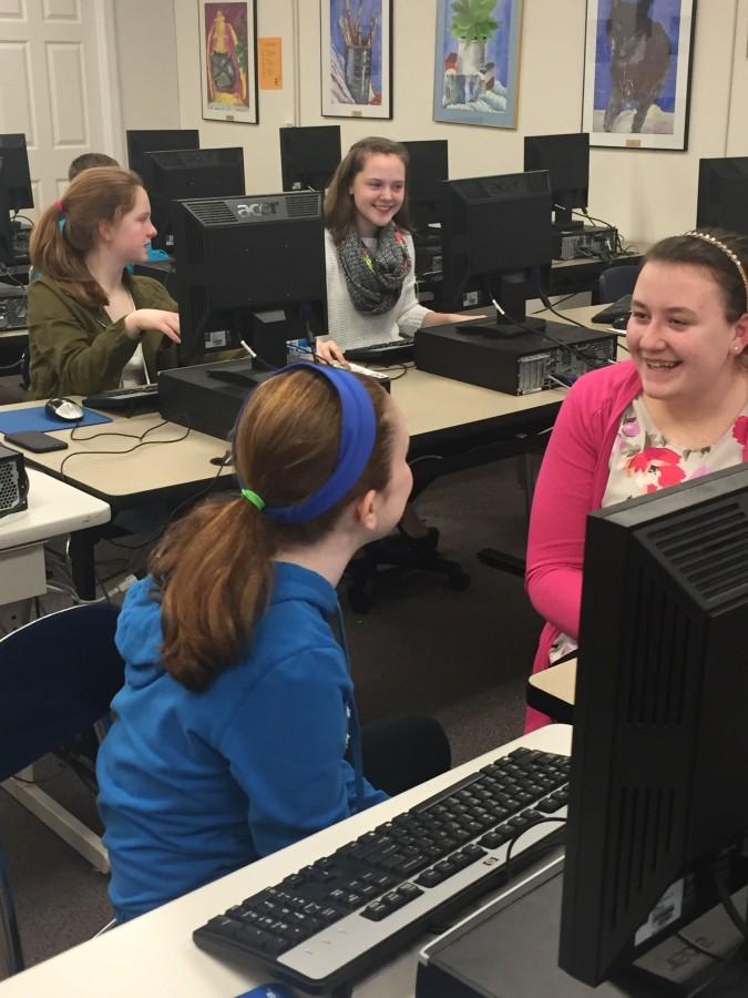 
Gates student journalists hard at work. The club meets Wednesday after school. Pictured: 7th grader, Anne Grace and 8th grader, Aurora Avallone in the foreground. In the background are 8th graders Hannah Gilmore and Erin Logan 8th grader. Photo courtesy of Ms. Simpson
