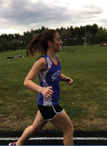 Senior, Rachel Sullivan runs her the 400 meter  race at her track meet. She gives all her effort to her one lap around the track. Photo credit to Maeve Dunn. 
