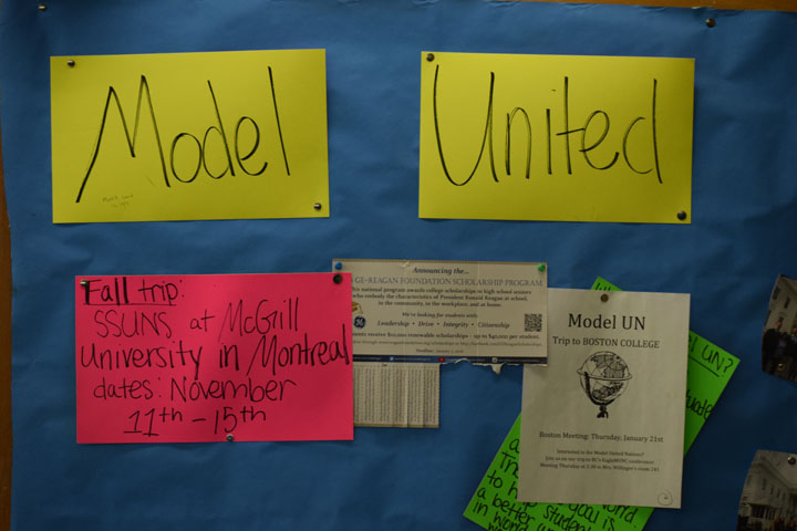 The+sign+promoting+the+Model+UN+club+hangs+in+the+History+wing+hallway.
