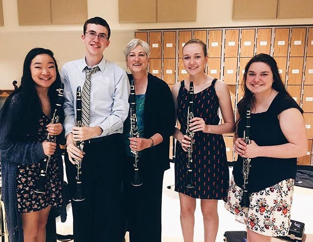 Emma Dwyer (far left) with her fellow clarinetists and former Band Director Sally Tucker 