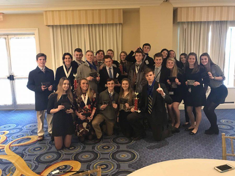 SHS students pose for a group photo, some students with their awards, at the conclusion of the DECA conference. Photo courtesy of Ben Smith