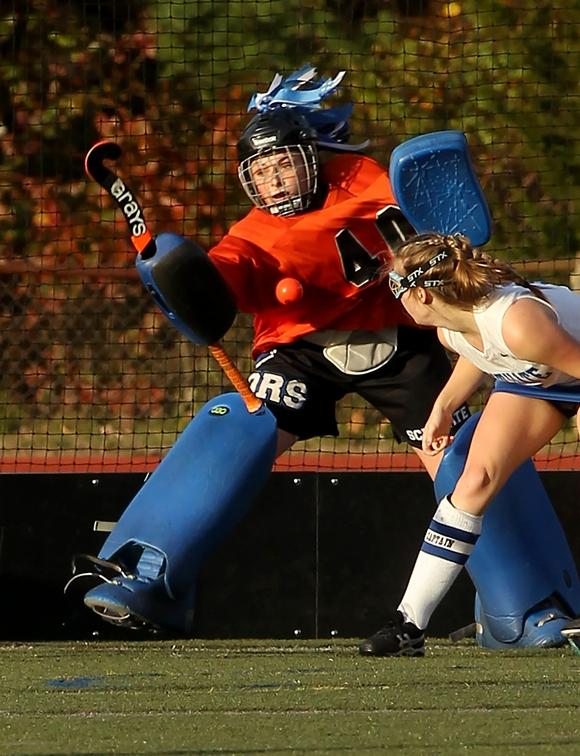 Senior Captain and goalie Christine MacCune defends a shot. Photo Courtesy of Christine MacCune