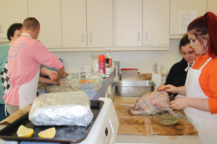 Students prepare part of their Thanksgiving meal. Photo Courtesy of Elena Goldthwaithe 