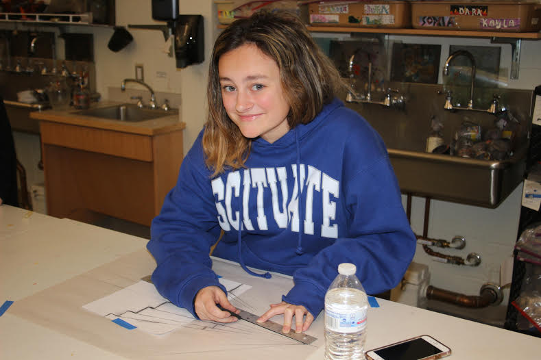 Halle Dowling working on a piece of art work in her AP art class. Photo Courtesy of Lauren Montgomery