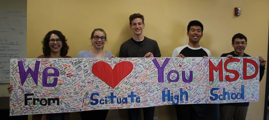 SHS Students (from left to right) Abby Hilditch, Emily Whitman, Birch Swart, Youta Adachi and Ryan Frankel hold the banner they made for SHS students to sign in support of the tragedy in Parkland, FL. Photo Courtesy of Lauren Montgomery