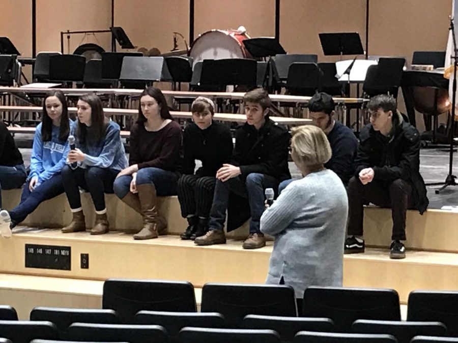 SHS guidance counselor Marlene Hoffman facilitates an alumni panel presentation featuring 19 SHS graduates