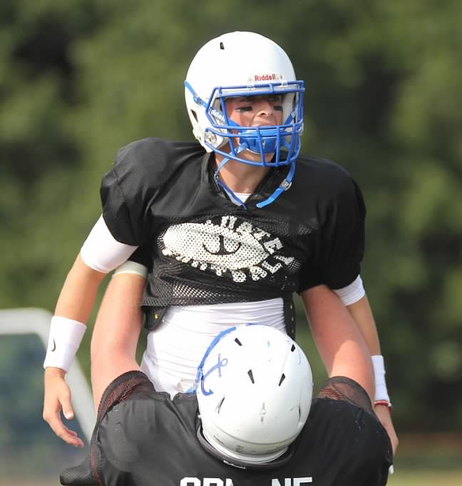 Aidan Sullivan being lifted by teammate Tommy Greene