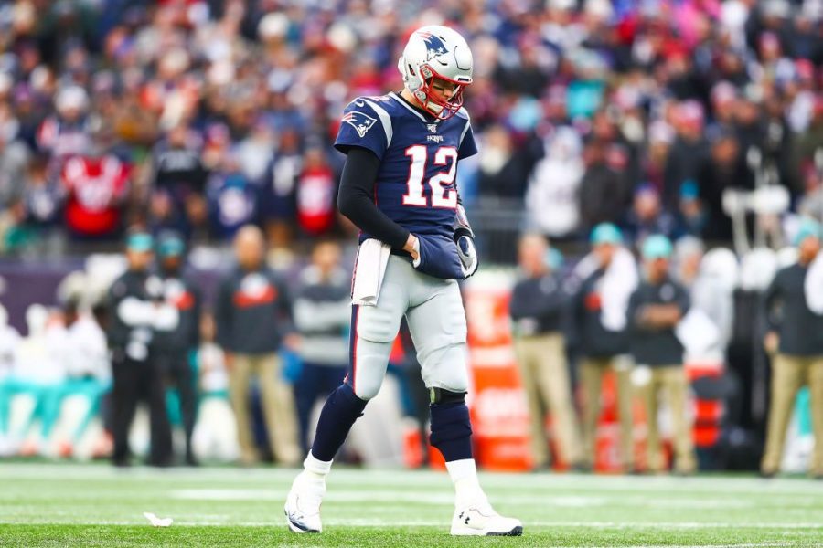 FOXBOROUGH, MA - DECEMBER 29:   Tom Brady #12 of the New England Patriots looks on during a game against the Miami Dolphins at Gillette Stadium on December 29, 2019 in Foxborough, Massachusetts.  (Photo by Adam Glanzman/Getty Images)