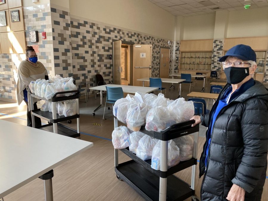 Carts with free student lunches are transported to the cafeteria