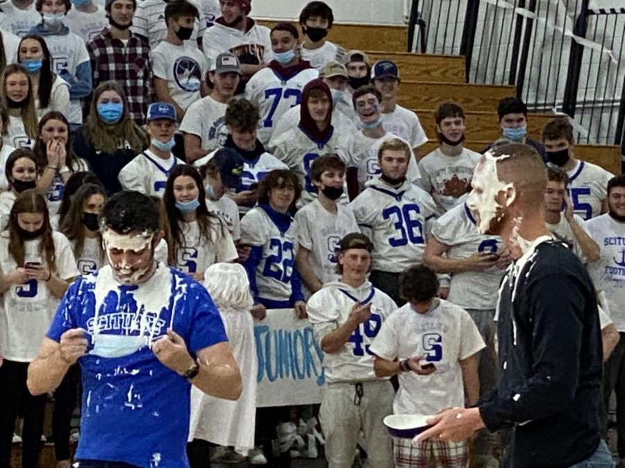 Phill Blake and Nick Sharry volunteered to take a pie in the face for charity