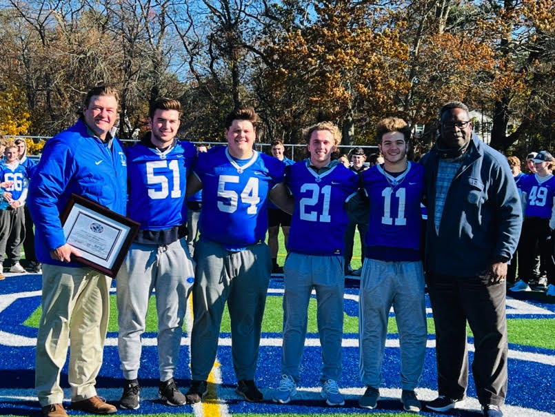 Coach Devine Reaches His 100th Win