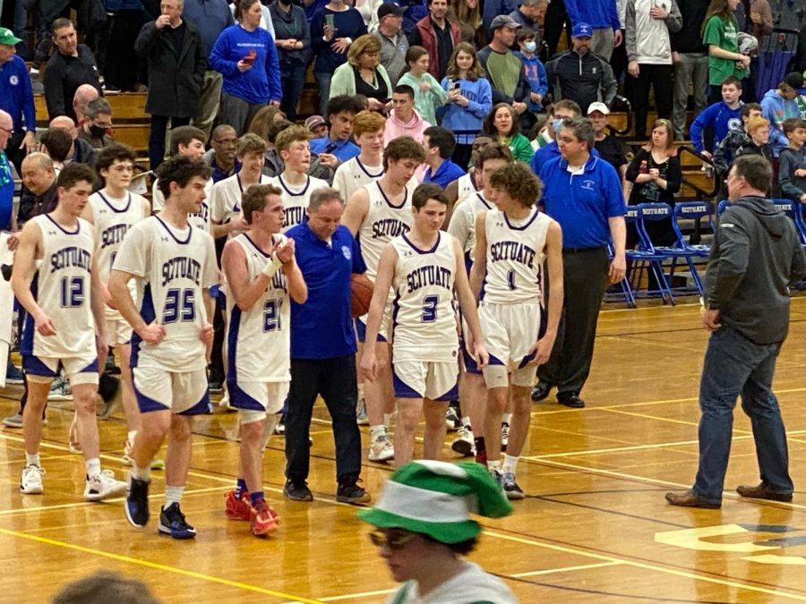 The Sailors gather in the middle of the court to collect Final Four trophy after their game against Wakefield on Friday, March 11th. 