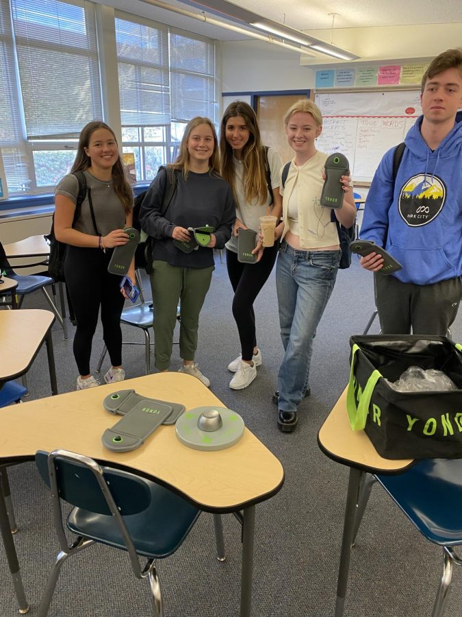 SHS juniors Elizabeth Kurtz, Emmy Curtin, Katerina Guyette, and Charles Holden are among a group of students voluntarily locking up their cell phones during the school day