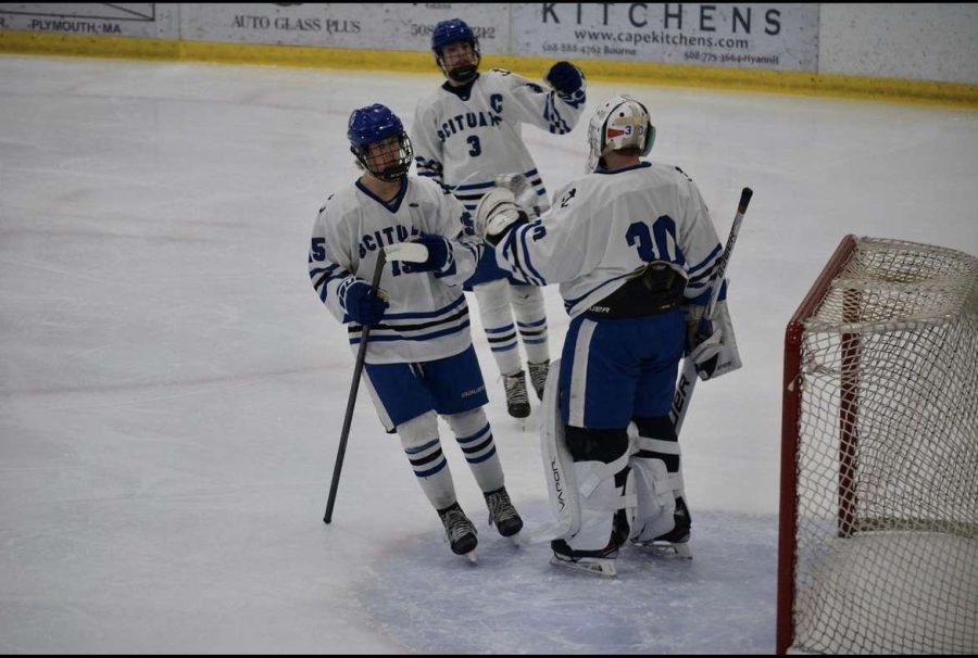 Matt Seghezzi and Peter Cappadona celebrate a save with goalie Thomas McMellon