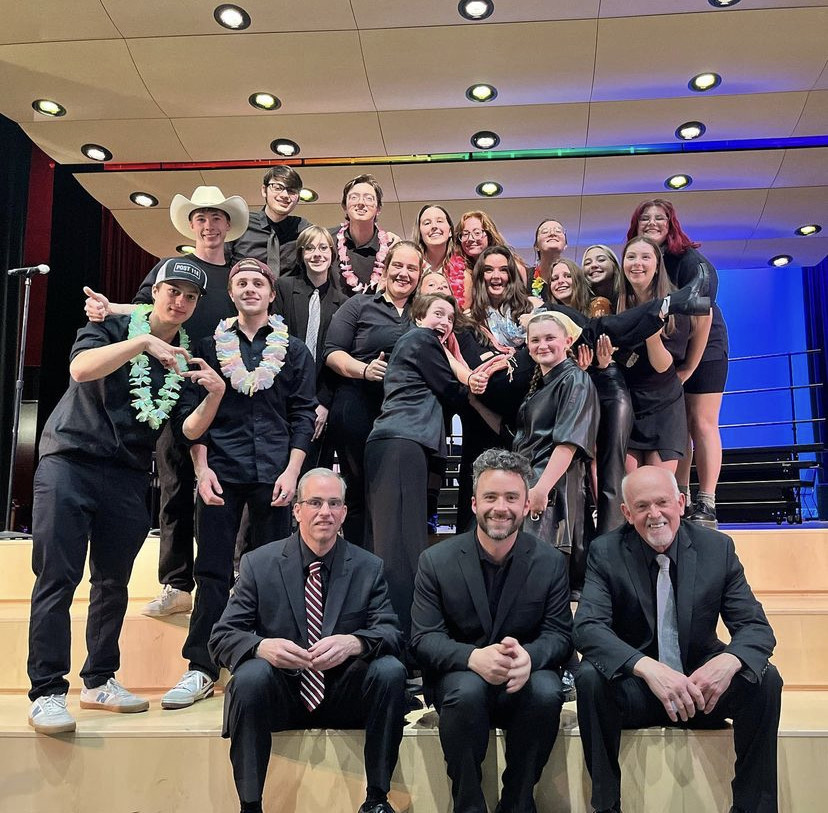 Band and chorus seniors pose for a photo with their music teachers following their final performance of the year