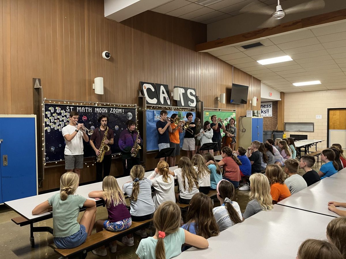 Pictured above: Cushing “Cool Cat” fourth graders met high school band students (left to right) seniors Matthew Short (trumpet), Riley Nidositko (tenor saxophone), Reagan Wood (alto saxophone), junior Liam Holden (trombone), seniors Patrick McClelland (trombone) and Matthew Carolan (flute), sophomore Kara DeLong (clarinet), juniors Caitlin Quinlan (flute) and Nicolai Bokavich (trumpet), and senior Madison Buckell (cello).


