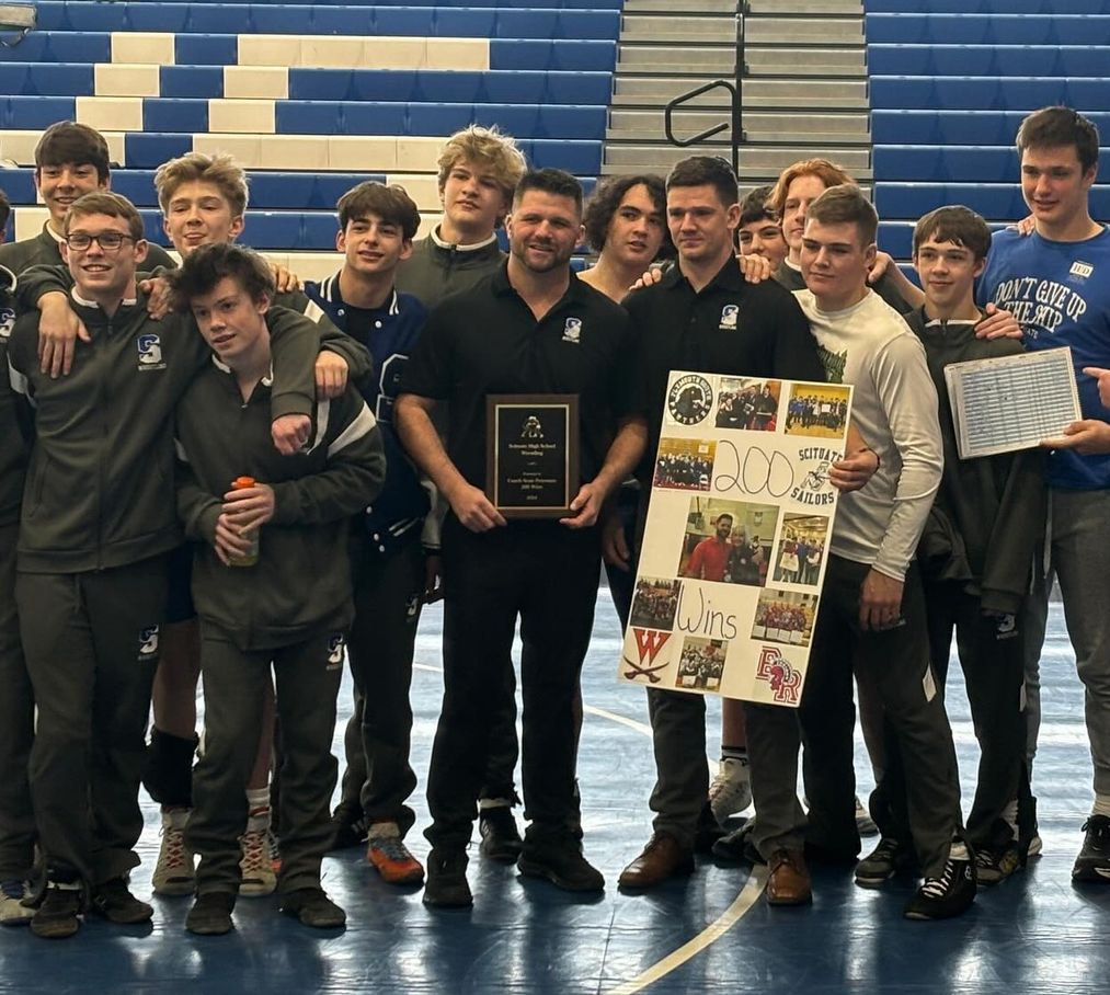 Coach+Petro+celebrates+his+200th+career+win+as+a+wrestling+coach+with+the+Scituate+Team.