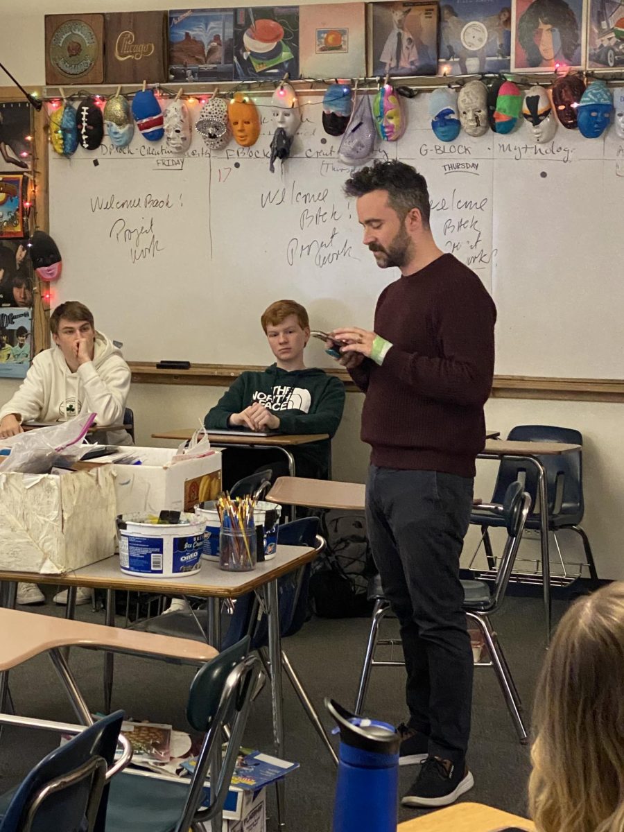 SHS music teacher Adam Gruschow shared one of his favorite poems, "The Wanderer," an Old English poem, with Creative Writing students