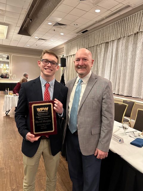 Senior David Murphy poses for a picture with his middle school social studies teacher, John Fitzgerald, during the January 28th banquet to honor Voice of Democracy district finalists. Murphy was selected to represent MA at the national level. 