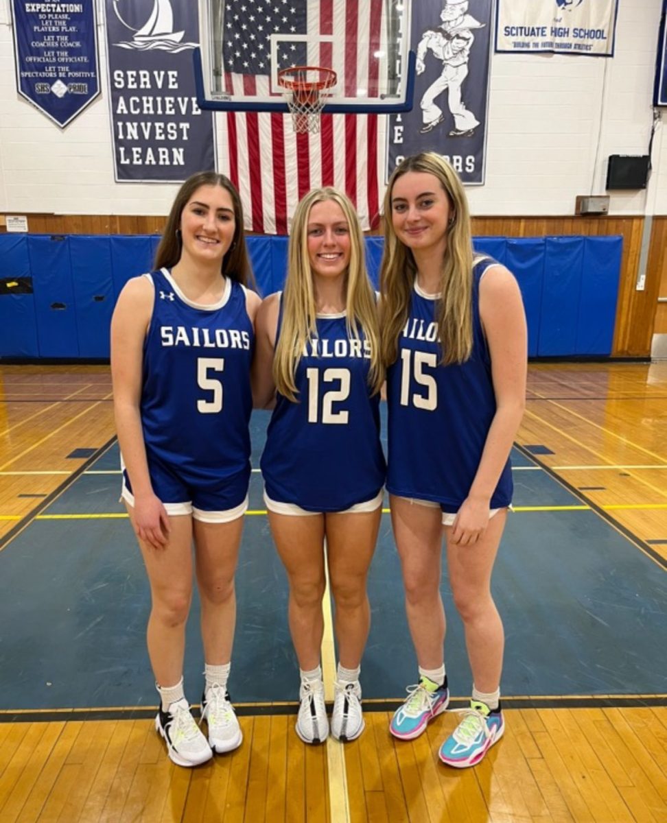 Girls' varsity basketball captains Louisa Kinsley, Casey McKeever, and Isabella Burns model leadership on and off the court