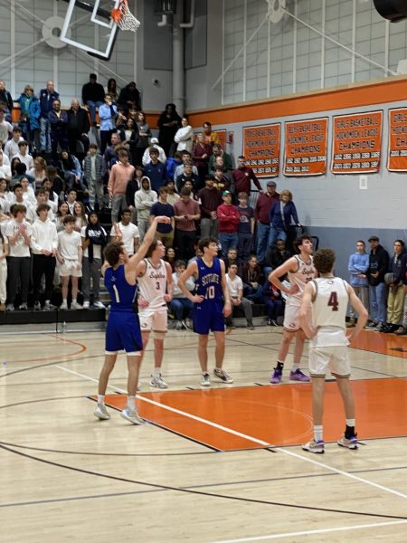 Senior Ryan Dunn shoots a free throw during the March 9th game against Sharon High School, putting Scituate ahead 23-22 during the second quarter 
