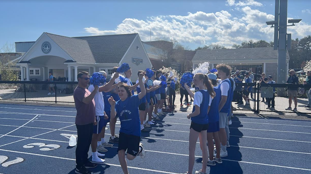 Max Reimels, a unified track athlete getting pumped up for his meet, supported by his fellow teammates and friends. 