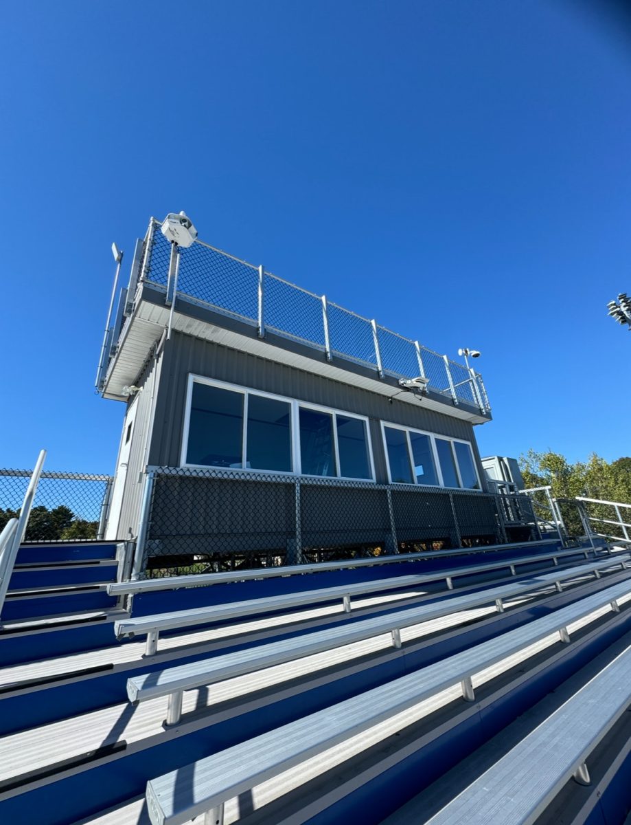 Video cameras are positioned on top of the stadium box to capture game play
