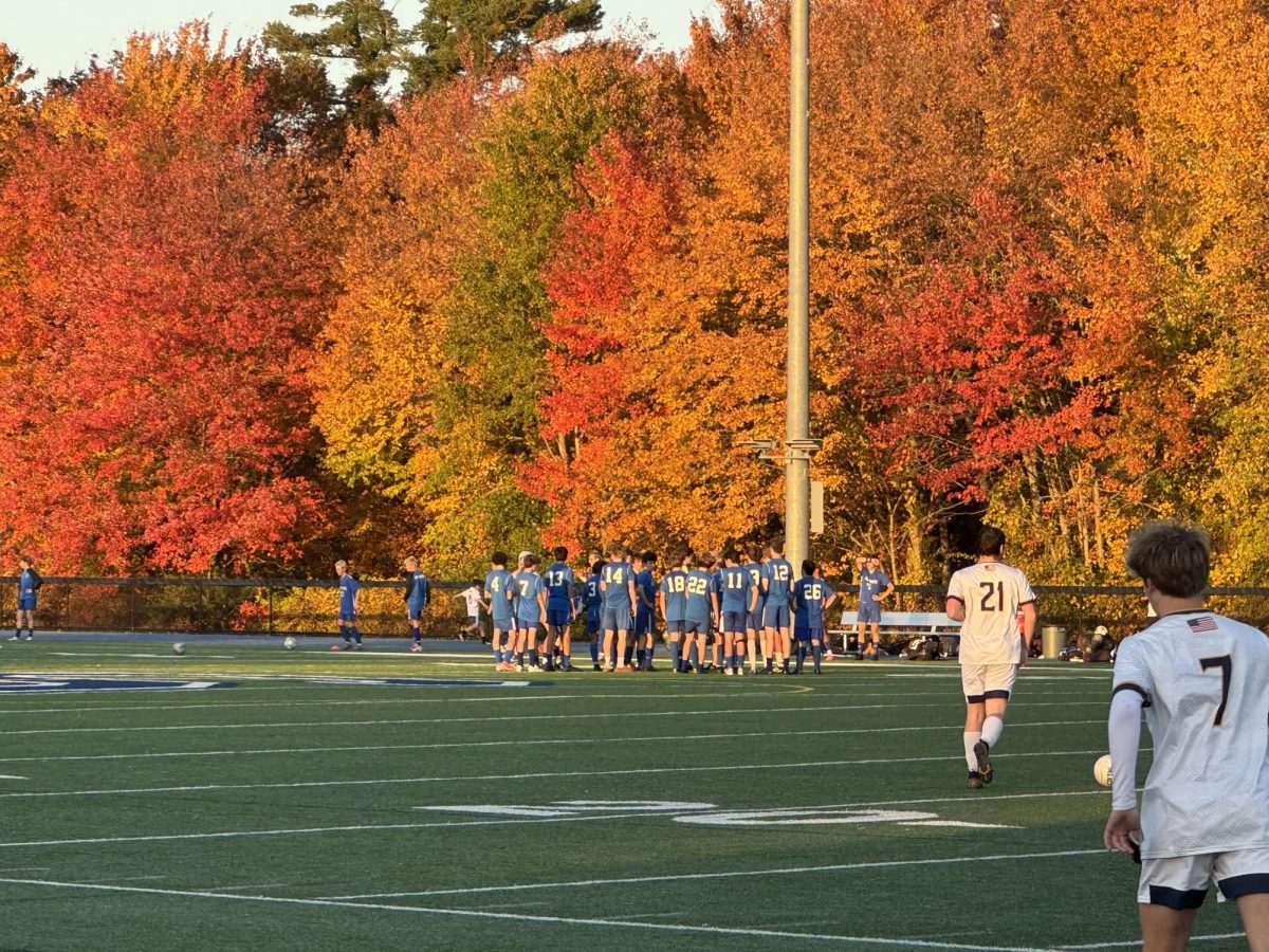 Fall colors create a majestic background for the boys' JV soccer team post-game