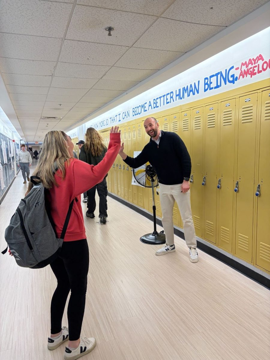 Sophomore Sydney McLean says hello to history teacher Mike Matisoff